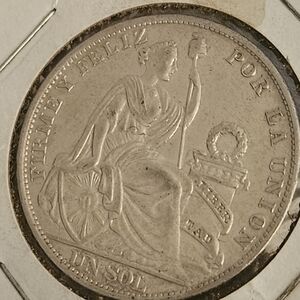 Vintage Silver Coin with Intricate Design